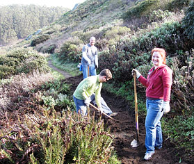 Volunteers working on a trail